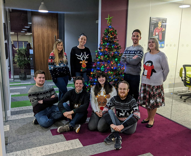 FM Team infront of the Christmas tree