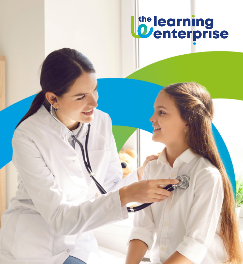 Smiling healthcare professional using a stethoscope on a young girl, representing compassionate care and training in eLearning for Healthcare.
