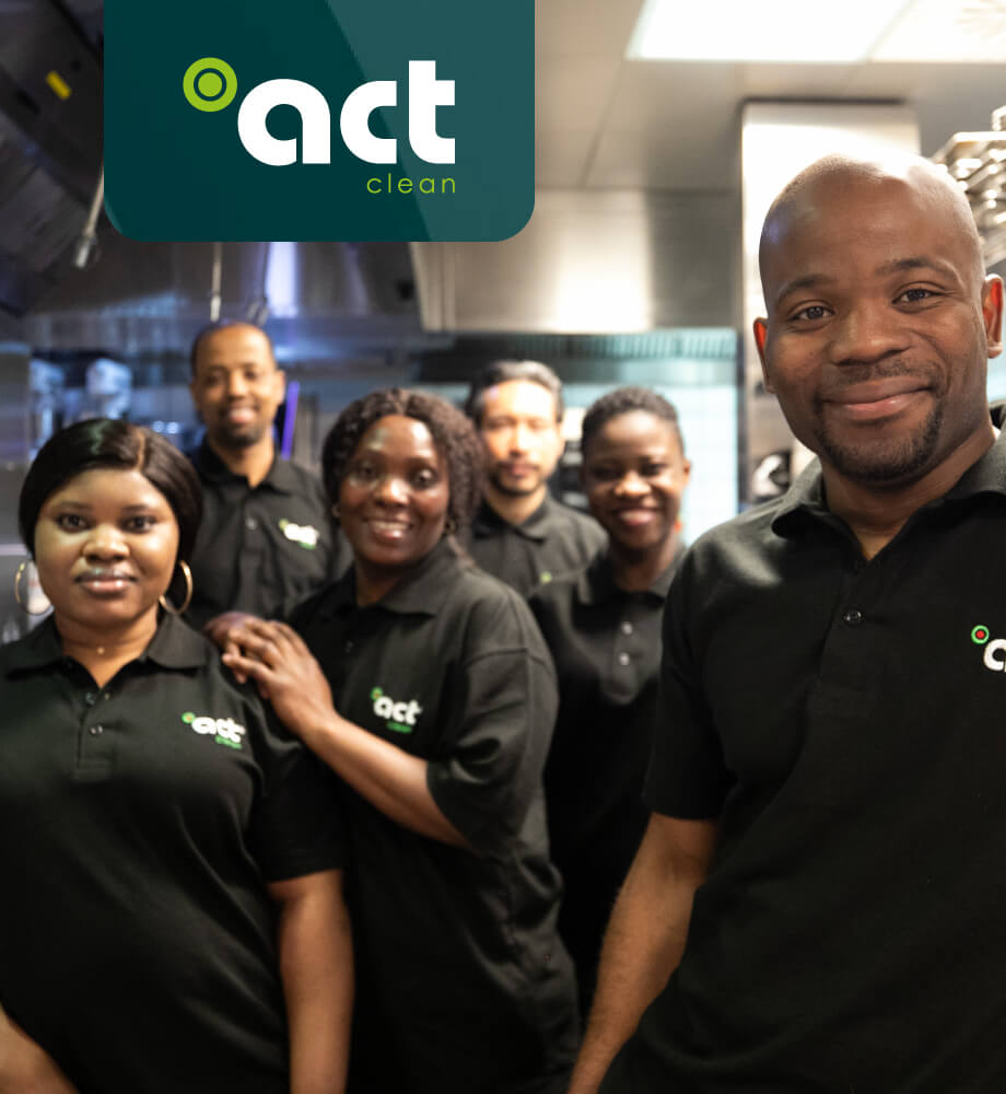 Group photo of Act-Clean hospitality staff in uniform with logo, emphasizing team development through eLearning in the Hospitality sector.